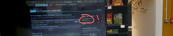 Steam page on a projector in a cafe with 'Released' highlighted